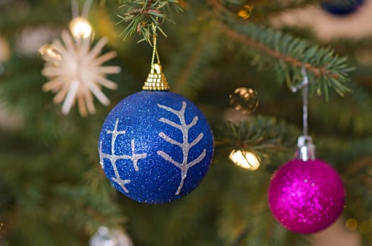 Decorations of christmas three, with mythological characters. Christmas-tree colored balls to decorate the Christmas tree.