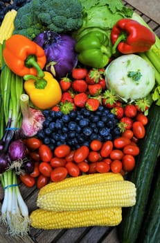 Fresh organic fruits and vegetables on a wooden table