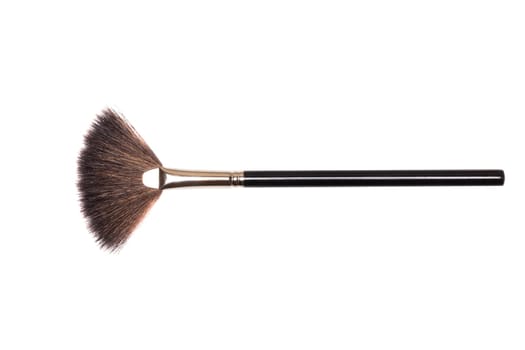 Beauty products. Closeup of a make-up brush isolated an a white background. Makeup cosmetic tools. Macro.