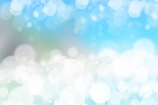 Abstract blurred festive winter christmas or Happy New Year background with shiny blue and white bokeh lighted snow landscape. Space for your design. Card concept.