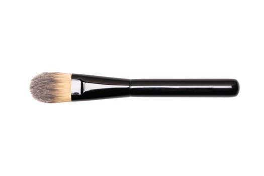 Beauty products. Closeup of a new make-up brush isolated an a white background. Makeup cosmetic tools. Macro.