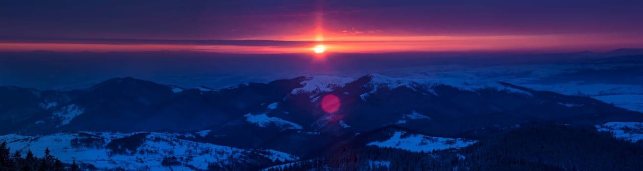 Beautiful sunrise in winter mountains of Transylvania