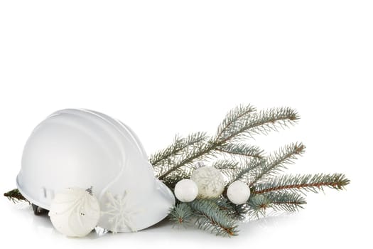Construction hard hat, fir tree branches and Christmas ornament isolated on a white background. New Year and Christmas. Horizontal view.
