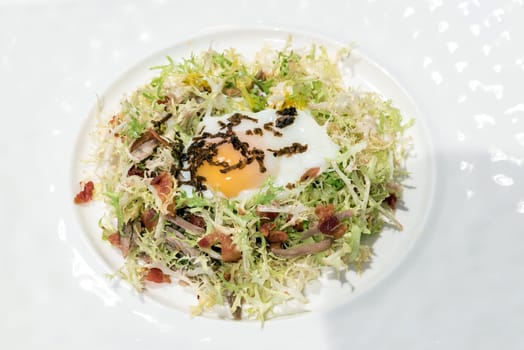 Egg salad with duck confit, groumet French Cuisine