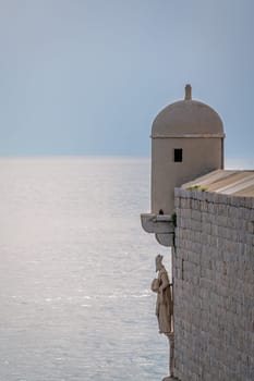 Saint sculpture attached to the Dubrovnik Old Town walls, Croatia
