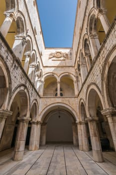 Arched inner courtyard in Sponza Palace in Dubrovnik Old Town, Croatia