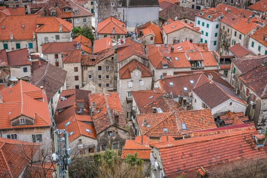 Aerial view of the red tiled houses roofs of Kotor Old town, Montenegro