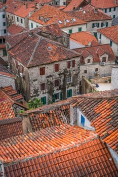 Aerial view of the red tiled houses roofs of Kotor Old town, Montenegro