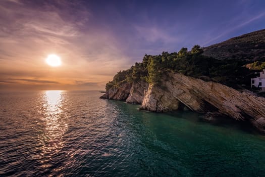 Beautiful sunset over the cliffs in Petrovac coast, Montenegro