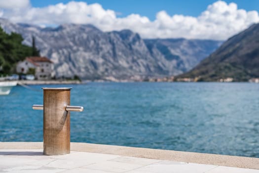 Steel anchoring bollard on the shore in the beautiful Perast town in the Kotor Bay, Montenegro