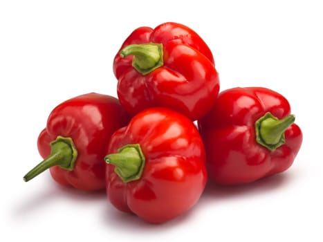 Four ripe Habanero peppers. Clipping paths, shadow separated, infinite depth of field