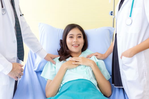 Portrait of female patient Relaxing  ans smile in bed of Hospital Ward