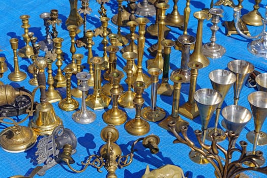Antique bronze and brass candle holders for sale at flea market