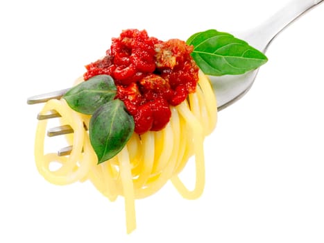 Spaghetti with tomato sauce and basil leaves on a fork. Infinite depth of field, clipping path