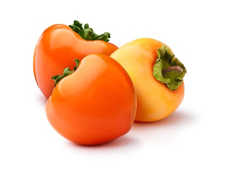 Group of whole Hachiya persimmon (fruit of Diospyros kaki) isolated on white. Hi gloss and matt appearance, infinite depth of field