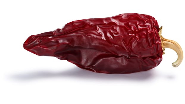 Chile seco del norte, a ripe dried Anaheim pepper. Clipping paths, shadows separated