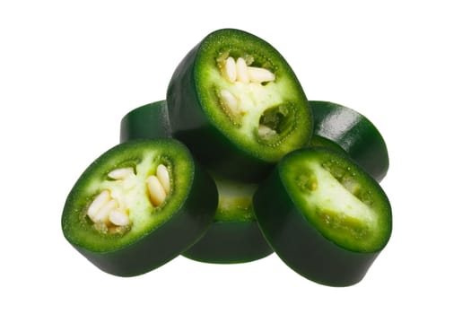 Sliced green Serrano pepper (Capsicum annuum). Clipping path, shadowless