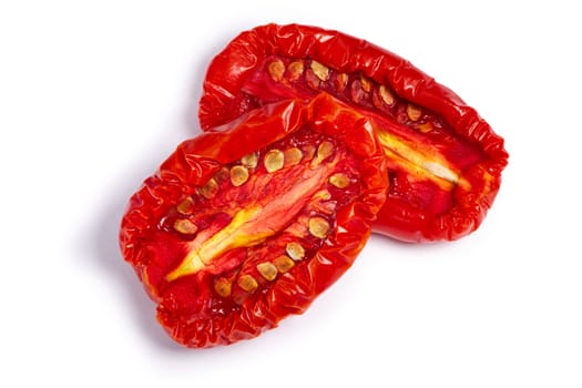 Sundried or dried tomato halves, top view. Clipping paths, shadow separated
