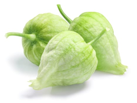 Three green Tomatillos (Physalis philadelphica) in their own husk. Clipping paths, shadow separated