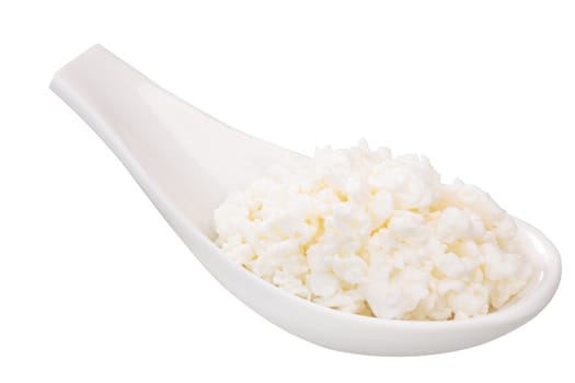 Fresh curd or cottage cheese, white ceramic spoon with or spoonful. Clipping path