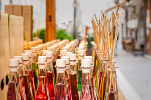 Colored bottles of fragrances with sticks for the fragrance of the house.