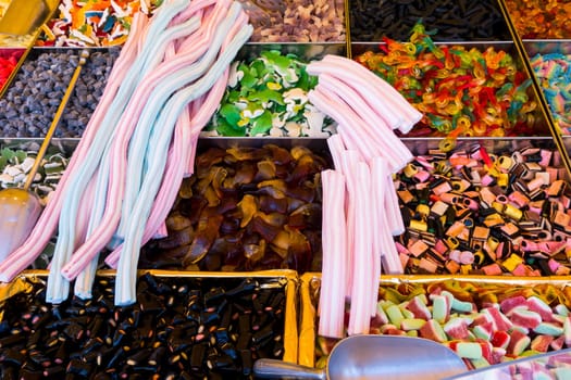 Caramel sweets and Bonbons. Retail. Collection of colorful gummy candies at market