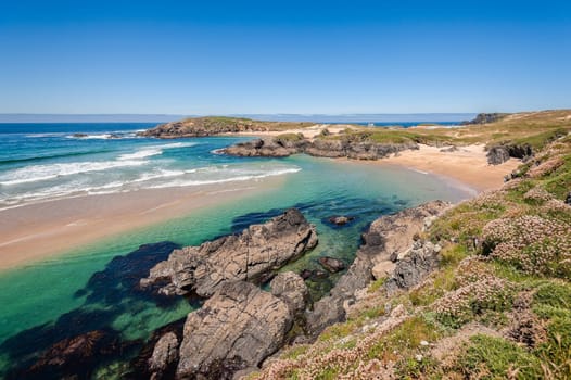 Landscape with sea,cliff, beach and blue sky. Galicia Spain. Vacation travel.