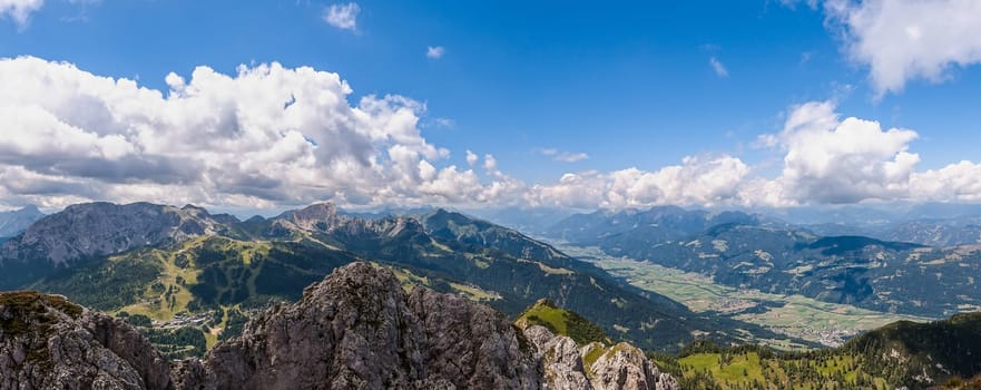 Mountain landscape with blue sky and clouds. Alps, Austria, Nassfeld.