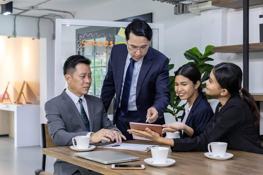 Business team have a meeting in a cafe