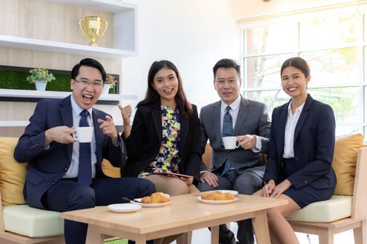 group of businessperson celebrate in cafe after success thier project