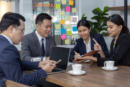 Business team have a meeting in a cafe