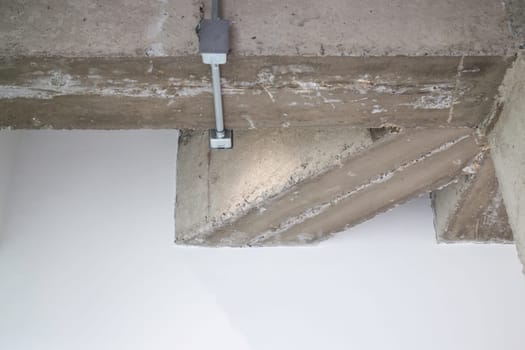 Ceiling metal pipe of electricity cable in building, stock photo