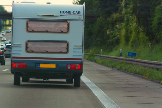 MOTORWAY A 61  GERMANY - AUGUST 13  2017:.Caravan on the A 61 motorway in tourist traffic near the city Grafschaft.