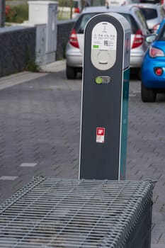 HEILIGENHAUS, NRW, GERMANY - AUGUST 24, 2017: Parking in Heiligenhaus charging of modern electric car on the road is the future of the automobile