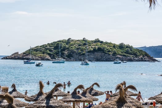 SANT ELM, MALLORCA, SPAIN - JUNE 04, 2016:.The bay of Sant Elm the beach with a view of the dragon island and sailing boats and motor yachts, Mallorca, Spain..