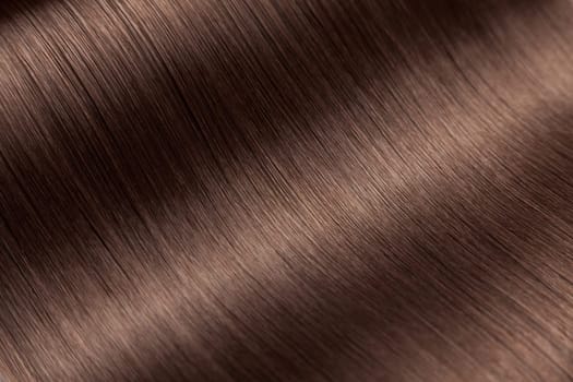 Closeup on luxurious straight glossy brown hair