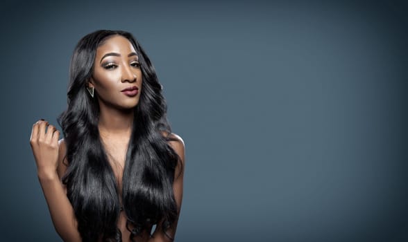 Black beautiful woman with long luxurious shiny hair