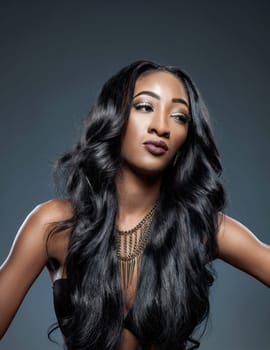 Black beautiful woman with long luxurious shiny hair