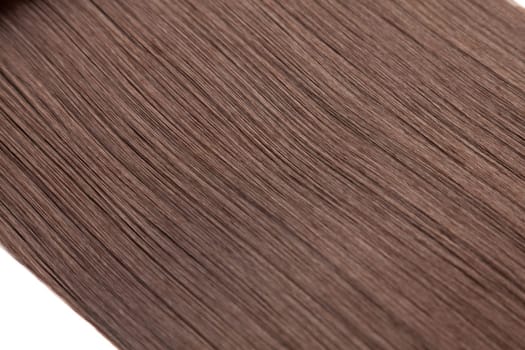 Closeup on luxurious straight glossy brown hair