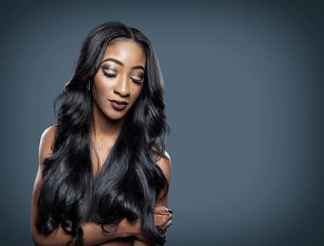 Black beautiful woman with long luxurious shiny hair
