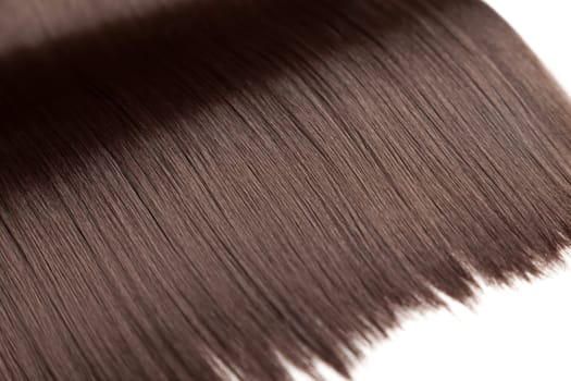 Closeup on luxurious straight glossy brown hair