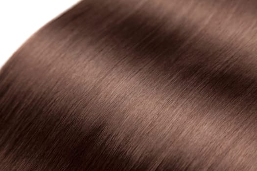 Closeup on luxurious straight glossy brown hair