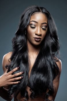 Black beautiful woman with long luxurious shiny hair