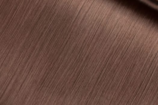 Closeup on luxurious straight glossy brown hair