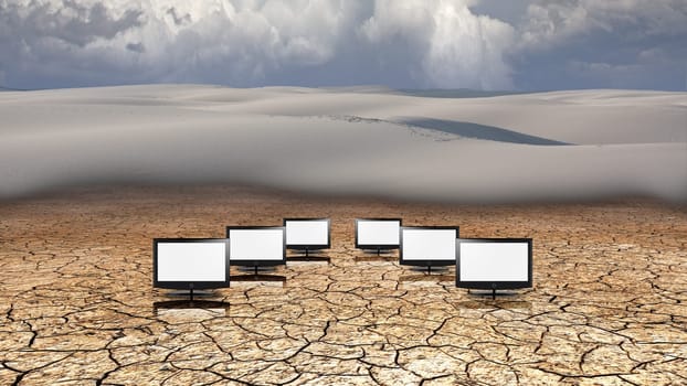 Surreal composition. Monitors in the desert