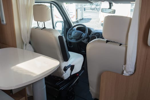 MUELHEIM RUHR  NRW  GERMANY - AUGUST 29  2017:.Vehicle interior view of a motorhome with a view of the steering wheel and driver as well as the passenger seat.