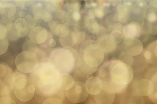Abstract blurred festive background for Christmas with bokeh defocused golden lights.