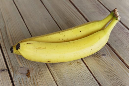 Ripe bananas on a rustic wooden table - natural source of magnesium