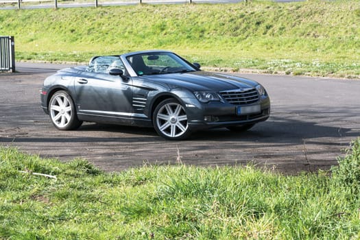 Mosel, Germany - March 26, 2016:.Chrysler Crossfire Roadster in a parking lot in Germany on the Mosel.