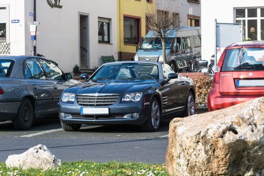 ZELTINGEN-RACHTIG, GERMANY - MARCH 26, 2016:.Chrysler Crossfire near in the parking lot in Zeltingen-Rachtig Uferallee in Germany on the Mosel.